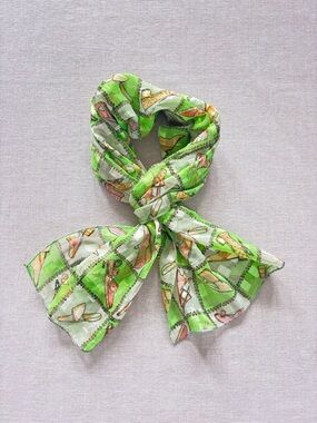 Sheer green shoe print scarf.